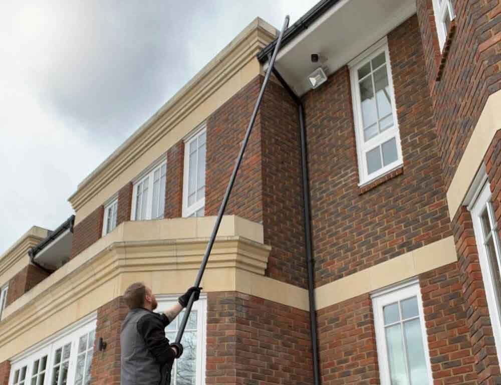 Surrey mansion having it's gutters cleared.